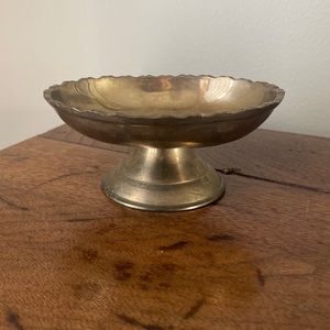 Solid Brass dish with scalloped edges.
